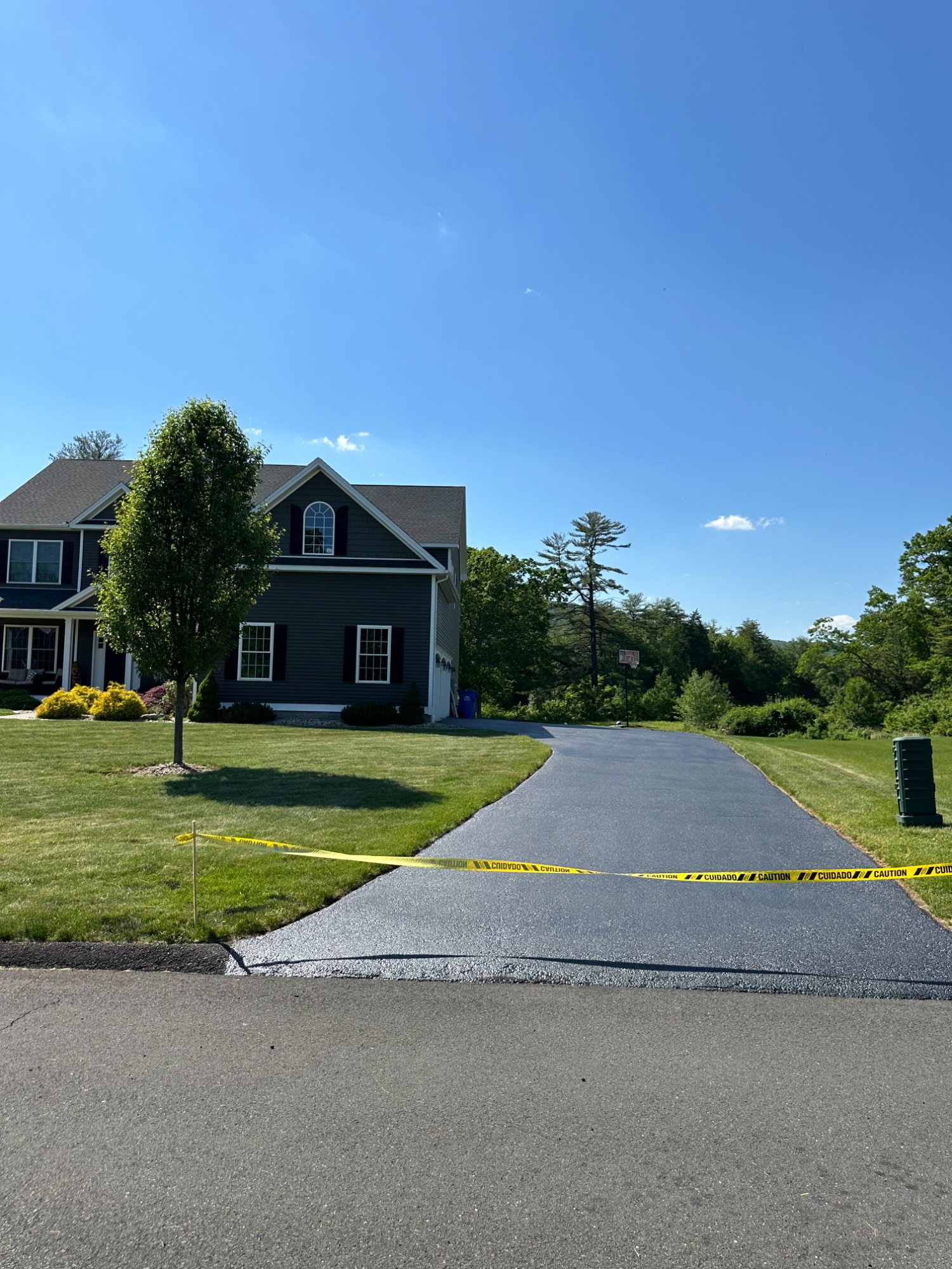Residential sealcoating, curved driveway